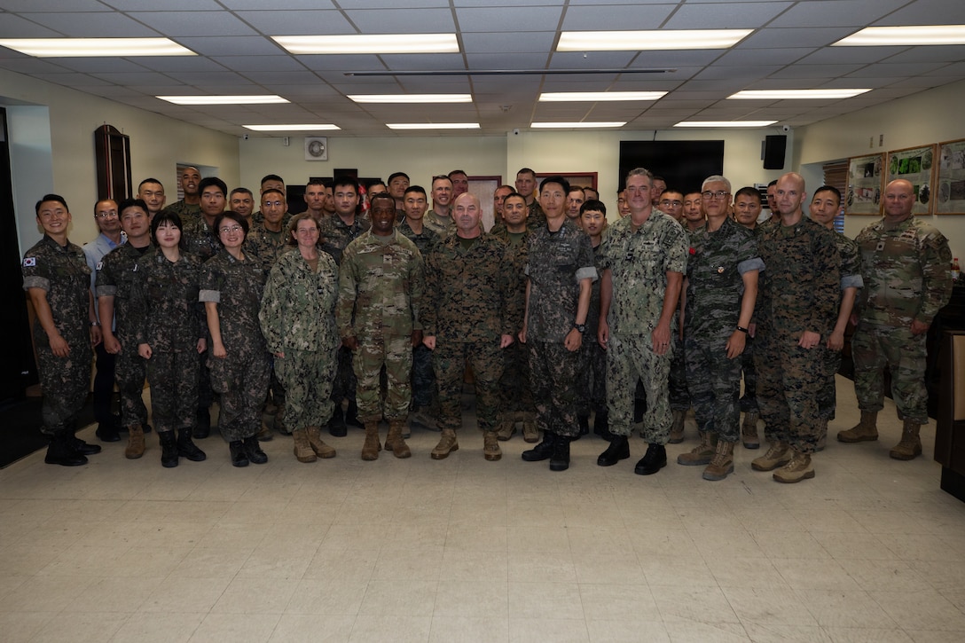 U.S. and Republic of Korea service members pose for a group photo during the opening ceremony for Combined Joint Logistics Over-the-Shore 26 at Camp Mujuk, Pohang, South Korea, July 6, 2026.