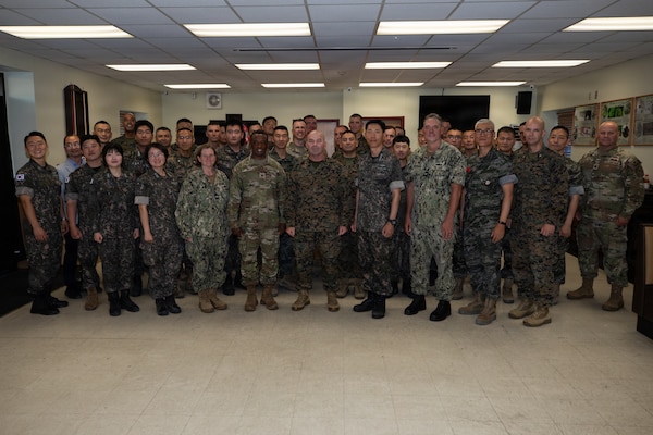 U.S. and Republic of Korea service members pose for a group photo during the opening ceremony for Combined Joint Logistics Over-the-Shore 26 at Camp Mujuk, Pohang, South Korea, July 6, 2026.