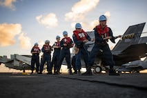 U.S. Navy Sailors heave in on the phone and distance line as Nimitz-class aircraft carrier USS Theodore Roosevelt (CVN 71) begins a fueling-at-sea with the Henry J. Kaiser-class fleet replenishment oiler USNS Guadalupe (T-AO 200) during Exercise Rim of the Pacific (RIMPAC) July 8, 2026. Thirty nations, over 30 surface ships, five submarines, 15 national land forces, more than 206 aircraft and 30,000 personnel are participating in RIMPAC in and around the Hawaiian Islands, June 24 to July 31. The world’s largest international maritime exercise, RIMPAC provides a unique training opportunity while fostering and sustaining cooperative relationships among participants critical to ensuring safety of sea lanes and security on the world’s oceans. RIMPAC 2026 is the 30th exercise in the series that began in 1971. (U.S. Navy photo by Mass Communication Specialist 3rd Class Alexander Bussman)