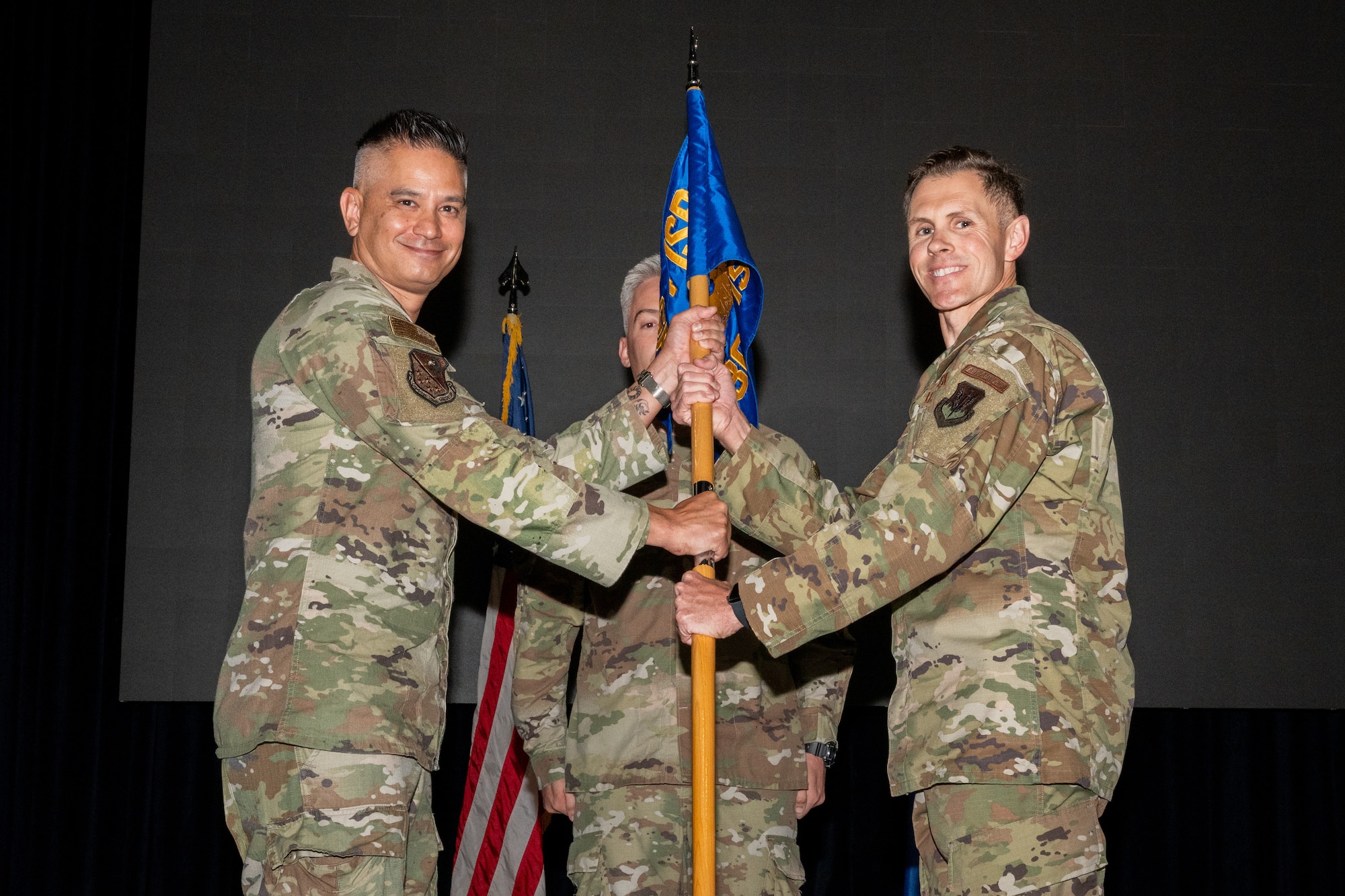 A guidon is passed ceremoniously to an incoming commander.