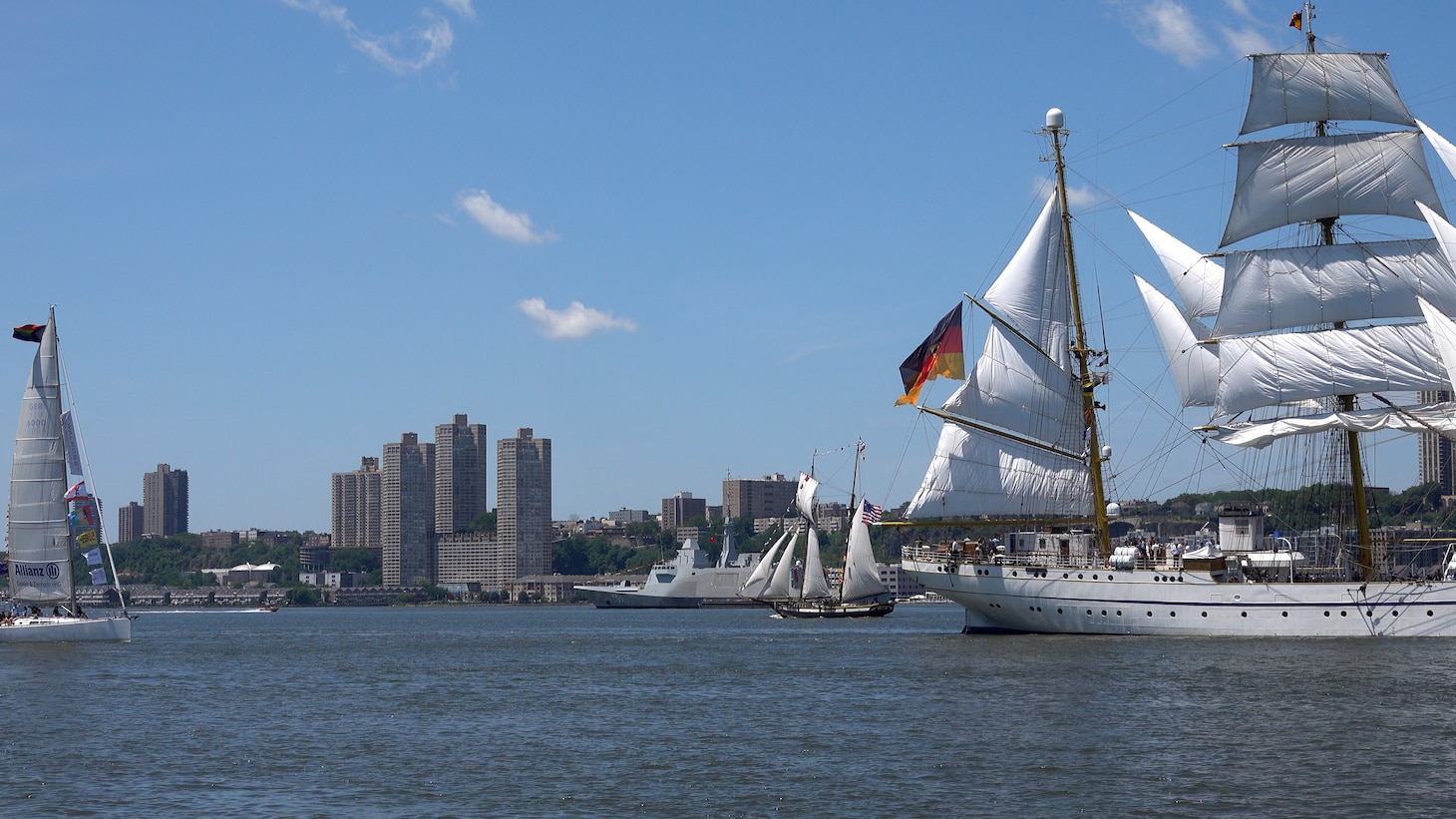 International tall ships transit the Hudson River near the Royal Moroccan Navy frigate RMNS Mohammed VI (701) during International Naval Review 250. The multinational maritime event commemorates the 250th anniversary of the United States and highlights cooperation among participating maritime forces. (U.S. Navy photo by Lt. Cmdr. Darius A. Radzius)