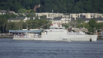 A French Naval Academy sailing vessel displays signal flags as it transits the Hudson River near the Royal Moroccan Navy frigate RMNS Mohammed VI (701) during International Naval Review 250. The multinational maritime event commemorates the 250th anniversary of the United States and highlights cooperation among participating maritime forces. (U.S. Navy photo by Lt. Cmdr. Darius A. Radzius)
