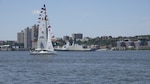 A French Naval Academy sailing vessel displays signal flags as it transits the Hudson River near the Royal Moroccan Navy frigate RMNS Mohammed VI (701) during International Naval Review 250. The multinational maritime event commemorates the 250th anniversary of the United States and highlights cooperation among participating maritime forces. (U.S. Navy photo by Lt. Cmdr. Darius A. Radzius)