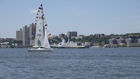 A French Naval Academy sailing vessel displays signal flags as it transits the Hudson River near the Royal Moroccan Navy frigate RMNS Mohammed VI (701) during International Naval Review 250. The multinational maritime event commemorates the 250th anniversary of the United States and highlights cooperation among participating maritime forces. (U.S. Navy photo by Lt. Cmdr. Darius A. Radzius)