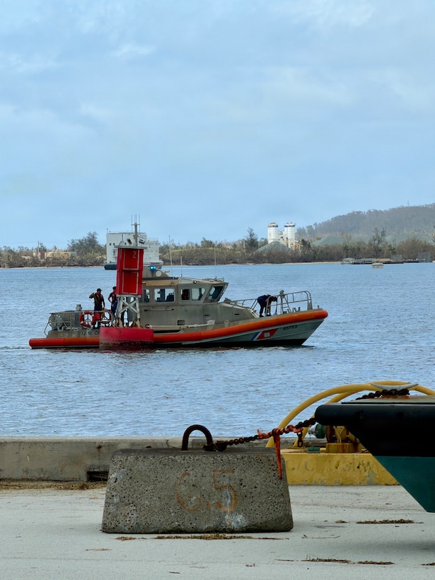 A U.S. Coast Guard Station Apra Harbor 45-foot Response Boat-Medium crew tows Buoy 2 from the entrance of Outer Apra Harbor, Guam, on July 9, 2026. U.S. Coast Guard Forces Micronesia/Sector Guam, Station Apra Harbor, and U.S. Navy Explosive Ordnance Disposal Mobile Unit Five personnel worked together to remove Buoy 2, which moved off station during the storm, into the channel, where vessels expect safe water. (U.S. Coast Guard photo by Chief Petty Officer Neil Rice)