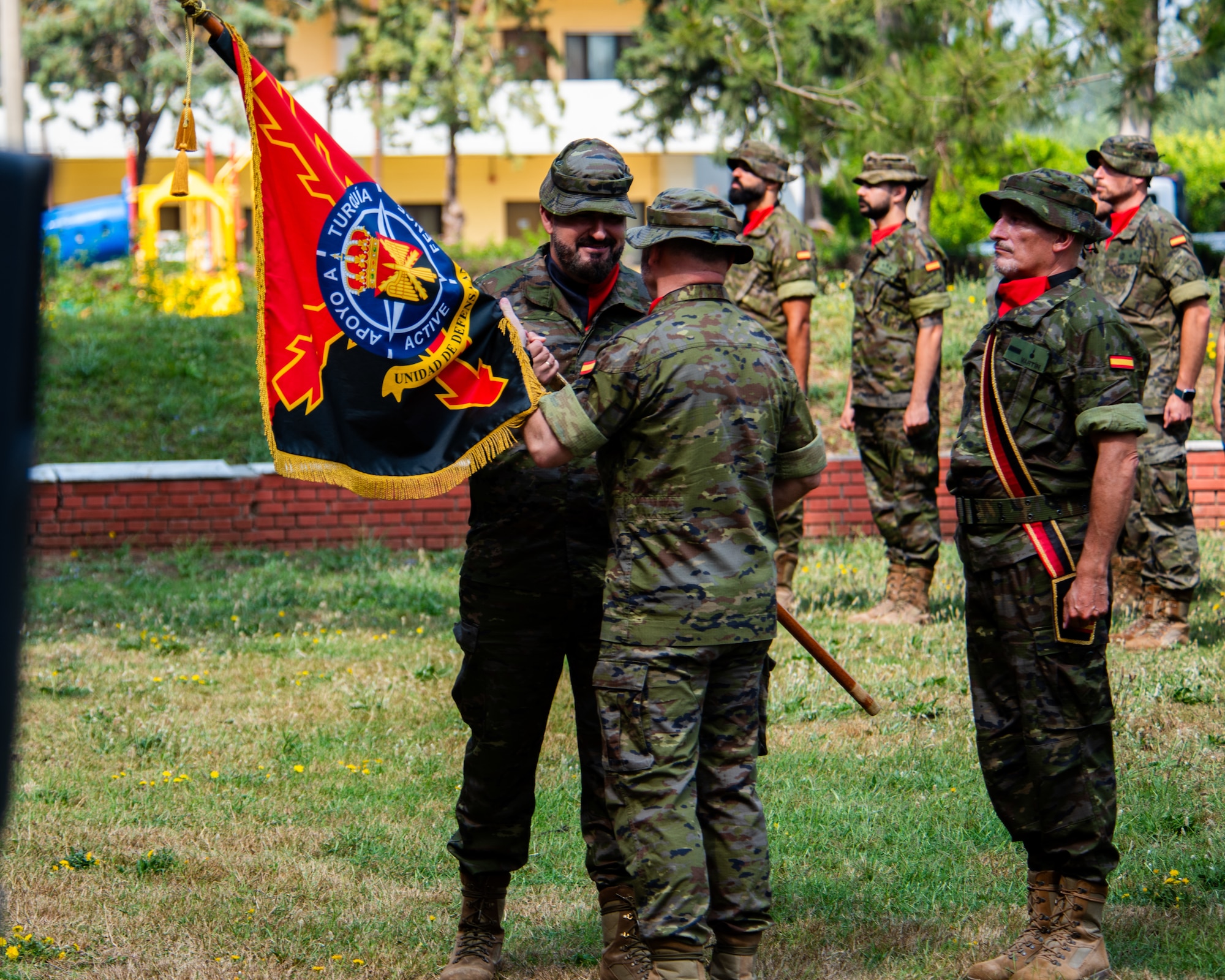 Spanish army Lt. Col. Leonardo Toledo Mira, Spanish Patriot Unit incoming commander, receives the guidon from Lt. Col. Lius Millan Burgos Sanchez, Spanish Patriot Unit outgoing commander.