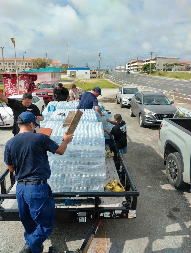 Personnel from U.S. Coast Guard Base Guam and Forces Micronesia/Sector Guam coordinate with the community in Guam to transport pallets of water to a U.S. Coast Guard HC-130J Hercules airplane from Air Station Barbers Point in concert with planned damage assessments of Rota in the Northern Mariana Islands, on July 9, 2026. U.S. Coast Guard crews continue to assess and rectify discrepancies to aids to navigation, waterways, and channel conditions across the Marianas following Super Typhoon Bavi. (U.S. Coast Guard photo by Lt. Cmdr. Elliot Kahl)