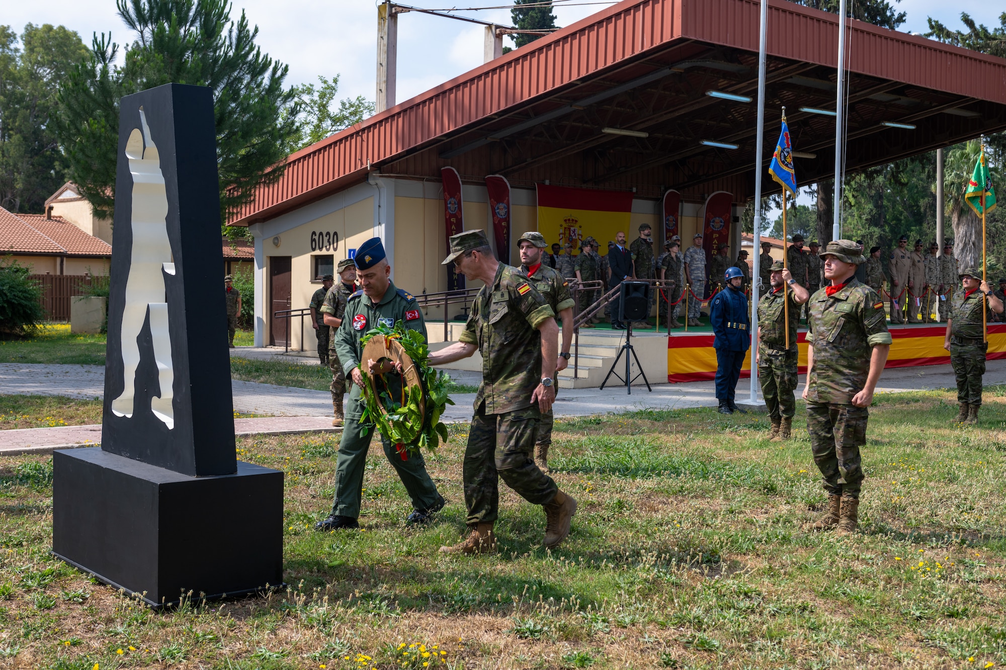 Turkish air force Brig. Gen. Kemal Güleç, 10th Main Jet Base Command commander, and Spanish Vice Admiral Enrique Nuñezde Prado Aparicio, Chief of Staff of the Spanish Joint Operations Command, place a ceremonial wreath on a memorial.