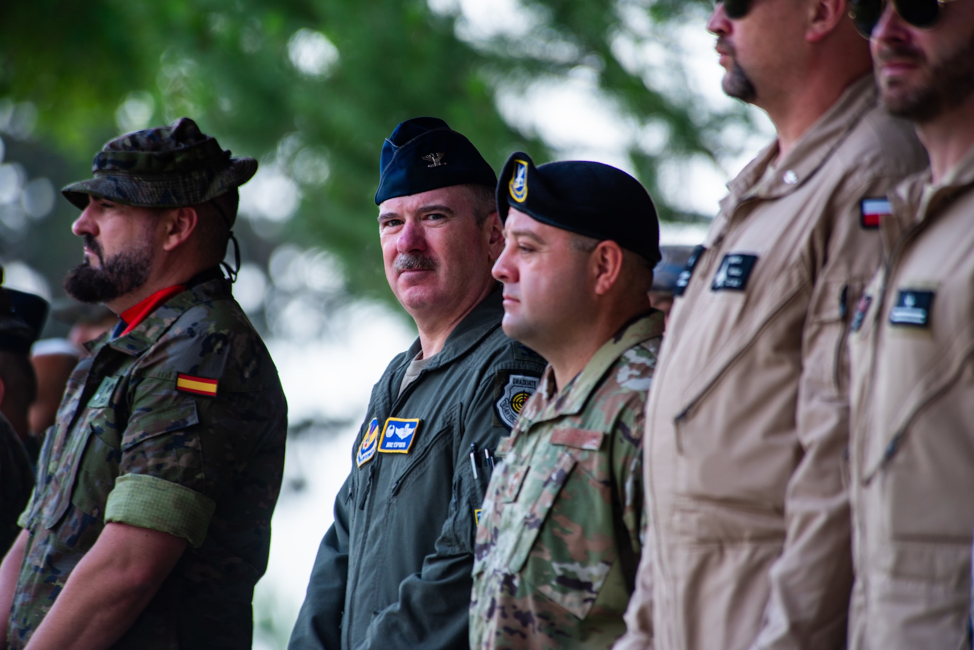 U.S. Air Force Col. Albert Esposito, 39th Air Base Wing commander, center, and Chief Master Sgt. David Izaguirre, 39th Security Forces Squadron senior enlisted leader, stand with NATO partner leadership.