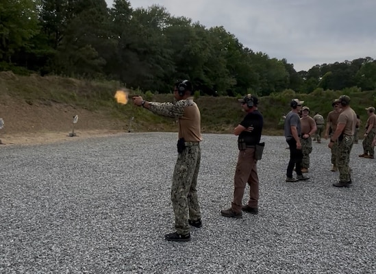 Master-at-Arms 2nd Class Gurjoban Singh, command master-at-arms assigned to Navy Medicine Readiness and Training Command (NMRTC) Twentynine Palms, fires a pistol under the guidance of instructors during Combat Skills Training (CST) in Suffolk, Virginia, June 11, 2026. The weeklong course prepares Expeditionary Medicine Sailors to operate in austere, high-threat environments by strengthening tactical skills, marksmanship and expeditionary readiness. (Courtesy photo).