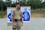 Master-at-Arms 2nd Class Gurjoban Singh, command master-at-arms assigned to Navy Medicine Readiness and Training Command (NMRTC) Twentynine Palms, poses with a target following a live-fire exercise during Combat Skills Training (CST) in Suffolk, Virginia, June 11, 2026. The weeklong course prepares Expeditionary Medicine Sailors to operate in austere, high-threat environments by strengthening tactical skills, marksmanship and expeditionary readiness. (Courtesy photo).