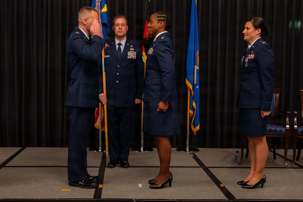 new commander salutes old commander during a change of command ceremony