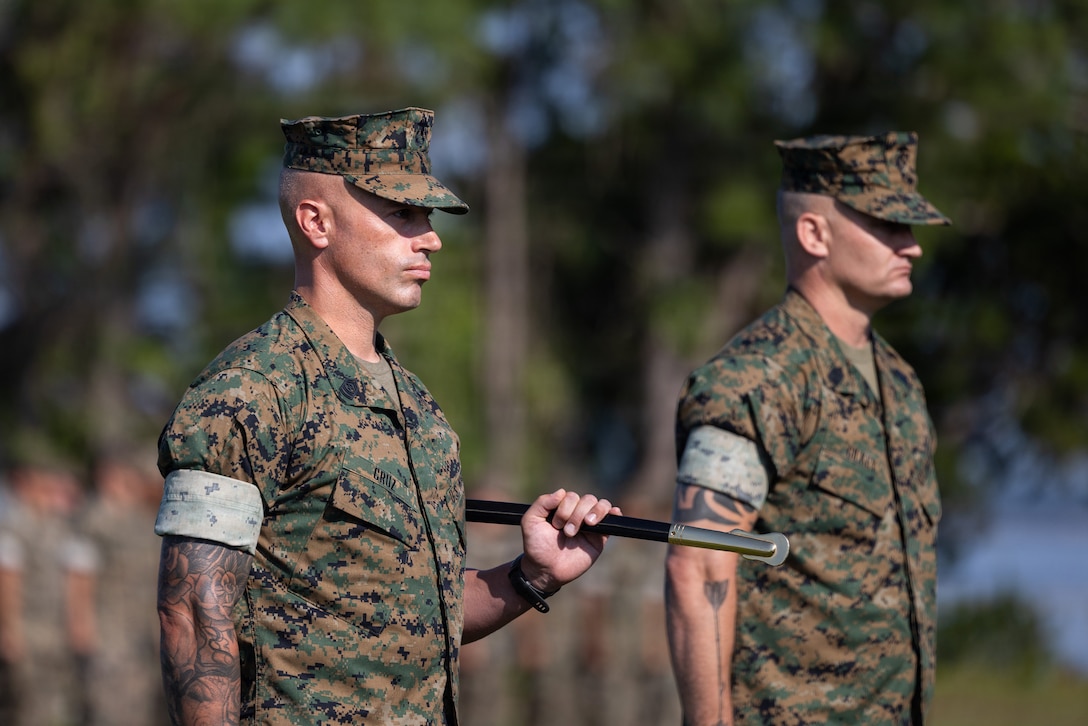 U.S. Marine Corps Sgt. Maj. Joey Cruz, the off-going sergeant major with 2nd Battalion, 10th Marine Regiment, 2nd Marine Division, stands at attention during a relief and appointment ceremony on Marine Corps Base Camp Lejeune, July 2, 2026.  
The relief and appointment ceremony was held to signify the passing of authority from Sgt. Maj. Cruz to Sgt. Maj. Gilkey (U.S. Marine Corps photo by Cpl. Jesse Davis)