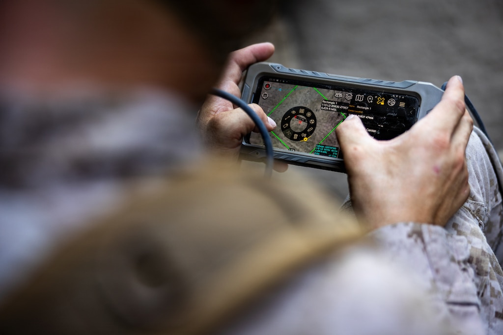 U.S. Marine Corps Capt. Alex Schermacher, a native of Ohio and a forward air controller with 5th Air Naval Gunfire Liaison Company, III Marine Expeditionary Force Information Group, operates an Android Tactical Assault Kit during Resolute Hunter 26-2 at Fallon, Nevada, June 15, 2026. Resolute Hunter is a biannual joint and coalition exercise that provides 5th ANGLICO a realistic operational environment to integrate reconnaissance and surveillance operations, refine communications tactics, techniques, and procedures, and strengthen joint force targeting and kill web integration in support of future deployments and multi-domain operations. (U.S. Marine Corps photo by Sgt. Raymond Tong)