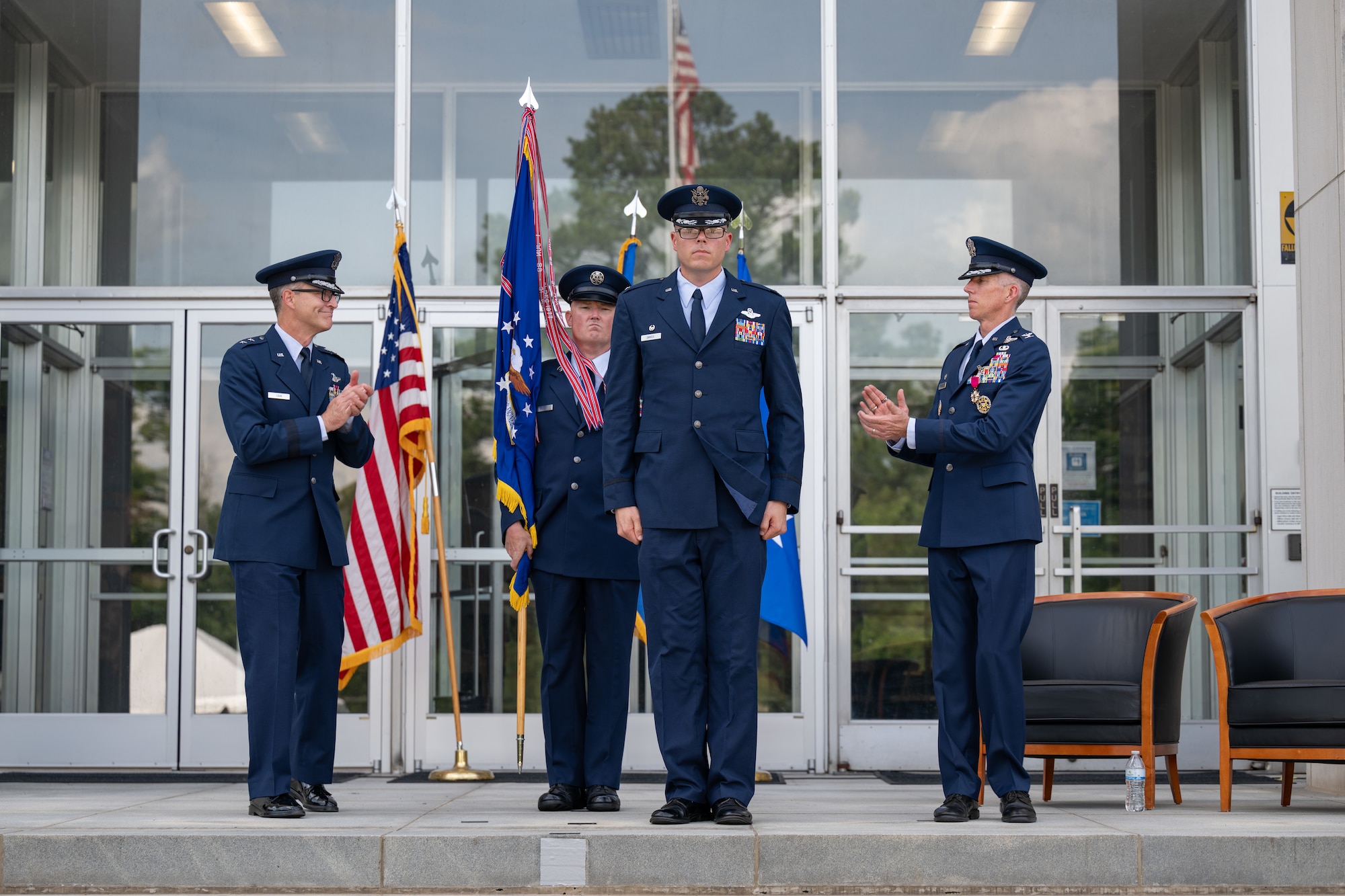 Col. Wayne Dirkes, second from right, is introduced as the new Arnold Engineering Development Complex commander during a June 27, 2026, Change of Command ceremony at Arnold Air Force Base, Tenn., headquarters of AEDC. The ceremony took place during the AEDC 75th anniversary open house celebration held on the same date at Arnold AFB. Prior to his latest assignment, Dirkes commanded the 704th Test Group, a unit of AEDC headquartered at Holloman Air Force Base, N.M. Also pictured are Air Force Test Center Commander Maj. Gen. Scott Cain, left, outgoing AEDC Commander Col. Grant Mizell, right, and AEDC Senior Enlisted Leader Chief Master Sgt. Evan McCoy. (U.S. Air Force photo by Keith Thornburgh)