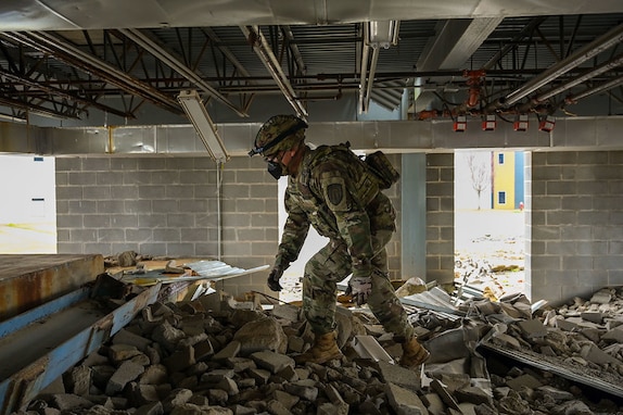 Specialist Frank Tomlinson, an emergency specialist assigned to the Georgia State Defense Force, performs search and rescue operations during exercise Patriot 25 at Guardian Centers in Perry, Georgia, March 24, 2025. (U.S. Air National Guard photo by Senior Airman Christa Ross)