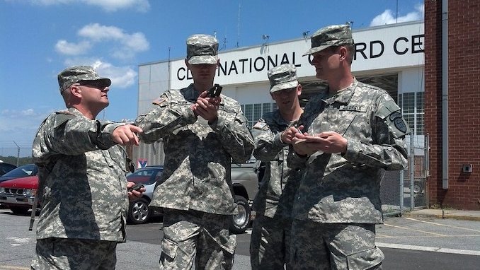 (From left) Georgia SDF Privates Roger Boles, Michael Blum, Johnathon Swanson, and Daniel Mayer form into a squad and prepare for their land navigation training exercise during Bravo Class 2012 Initial Entry Training.
