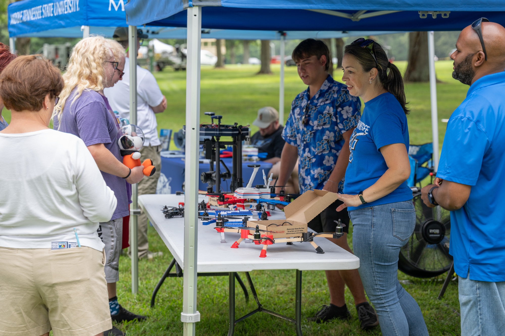 Staff from Middle Tennessee State University show off drones made from items such as Legos and pizza boxes during the Arnold Engineering Development Complex 75th anniversary open house celebration June 27, 2026, at Arnold Air Force Base, headquarters of AEDC. The public open house was held to coincide with the original June 25, 1951, dedication of AEDC. The event featured a STEM area where attendees could learn about science and technology. (U.S. Air Force photo by Keith Thornburgh)