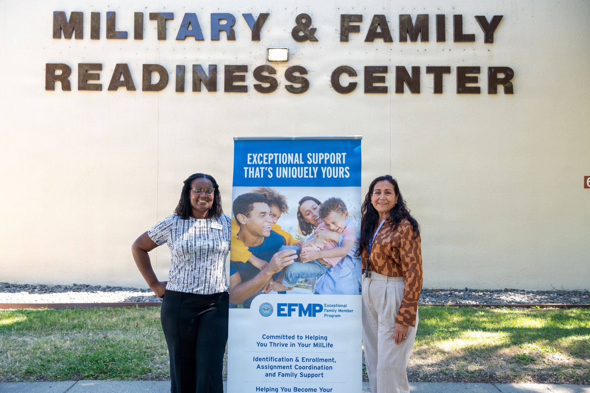Exceptional Family Member Program Support staff stand in front of the Military & Family Readiness Center