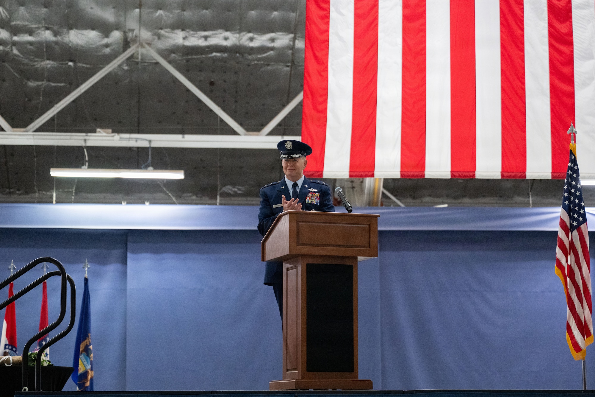 Officer speaks at a podium.