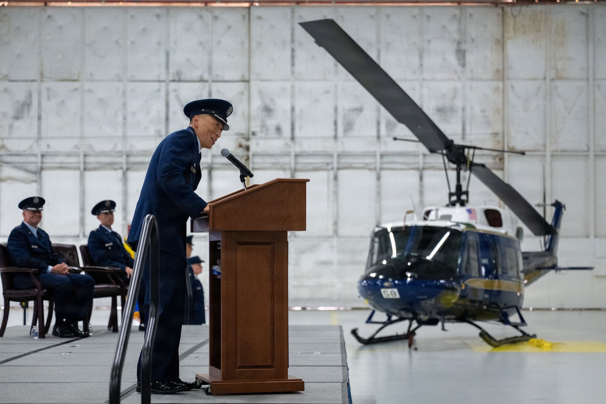 Officers speaks at a podium.