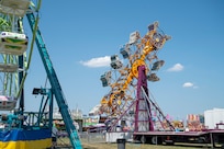 A carnival ride swings during Freedom Fest at Joint Base Anacostia-Bolling, Washington, D.C., July 4, 2026. The three-day event allowed service members and their families to celebrate America’s 250th Independence Day. (U.S Air Force photo by Senior Airman Shanel Toussaint)