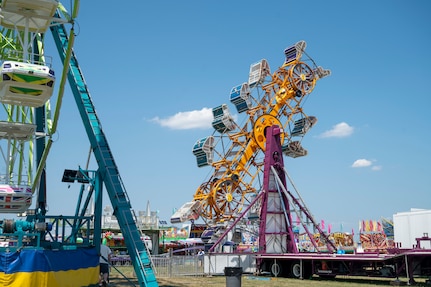 A carnival ride swings during Freedom Fest at Joint Base Anacostia-Bolling, Washington, D.C., July 4, 2026. The three-day event allowed service members and their families to celebrate America’s 250th Independence Day. (U.S Air Force photo by Senior Airman Shanel Toussaint)