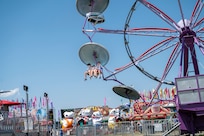 Kids ride a Ferris wheel during Freedom Fest at Joint Base Anacostia-Bolling, Washington, D.C., July 4, 2026. The three-day event featured carnival rides, food trucks and a variety of games and activities to celebrate the nation’s historic birthday. (U.S Air Force photo by Senior Airman Shanel Toussaint)