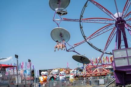 Kids ride a Ferris wheel during Freedom Fest at Joint Base Anacostia-Bolling, Washington, D.C., July 4, 2026. The three-day event featured carnival rides, food trucks and a variety of games and activities to celebrate the nation’s historic birthday. (U.S Air Force photo by Senior Airman Shanel Toussaint)
