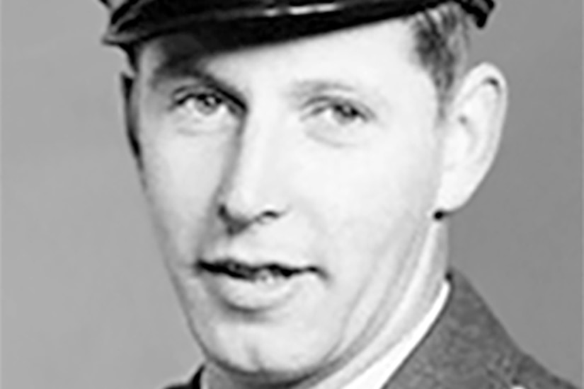 A man in a formal military uniform.