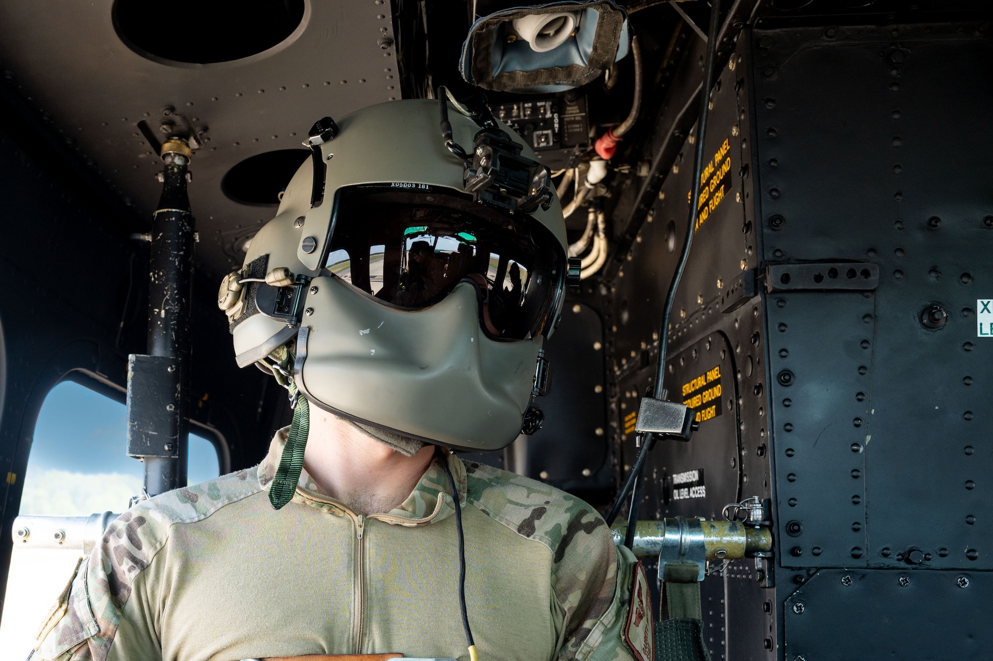a flight engineer assigned to the 1st Helicopter Squadron, prepares for takeoff