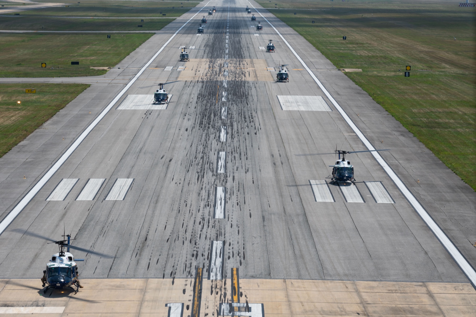 15 UH-1Ns taxied in close succession before departure.