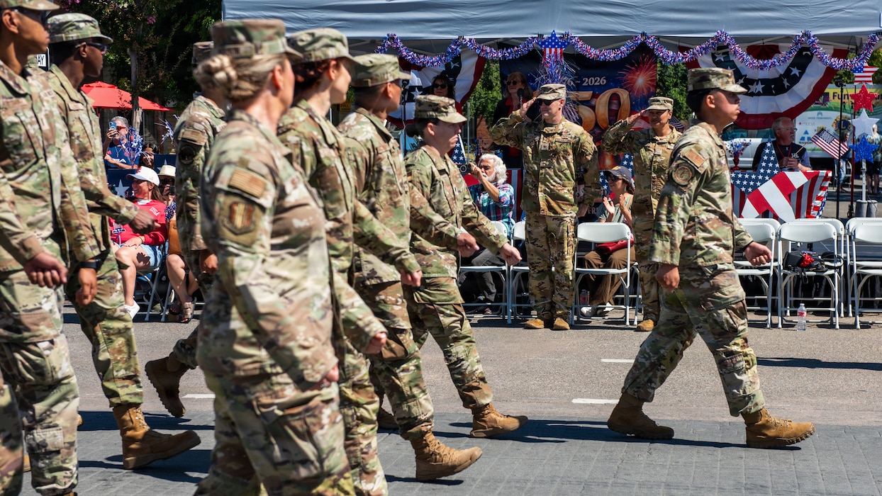 Airmen salute leadership at viewing stand