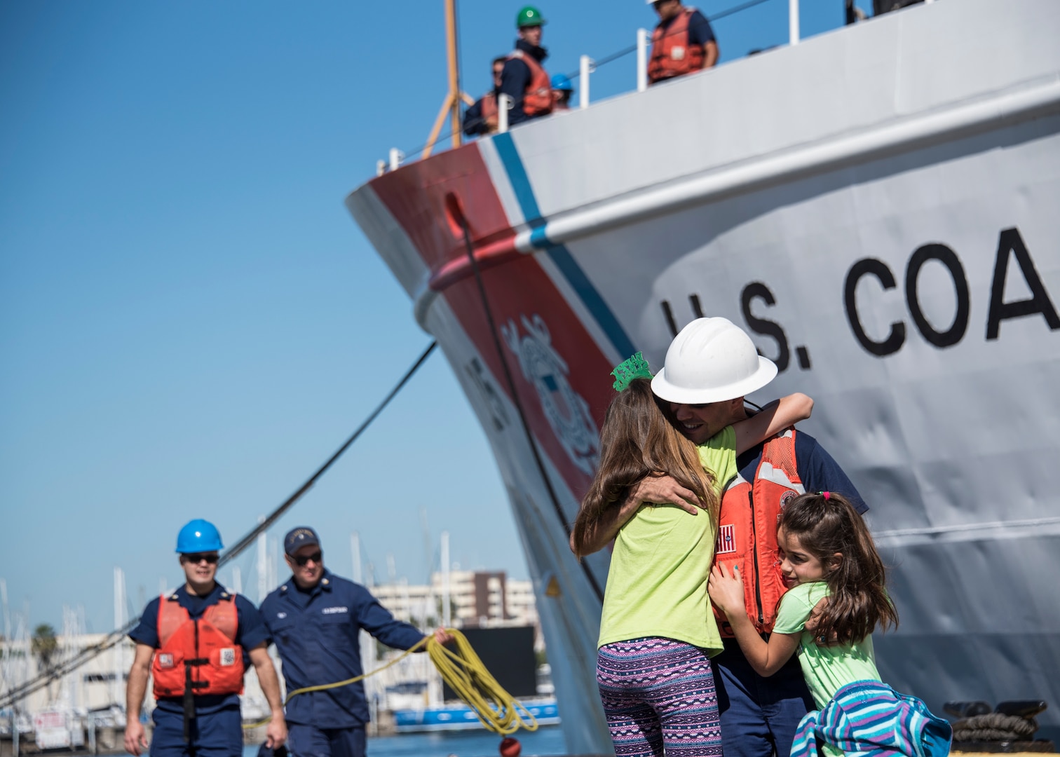 Chief Petty Officer Javier Pagan, a crewmember aboard the Coast Guard Cutter Venturous, greets his daughters Saturday, March 17, 2018 after returning home to St. Petersburg, Florida. The crew of the Venturous returned to homeport after a 60-day counter-drug patrol in the Eastern Pacific Ocean. (U.S. Coast Guard photo by Petty Officer 1st Class Michael De Nyse)