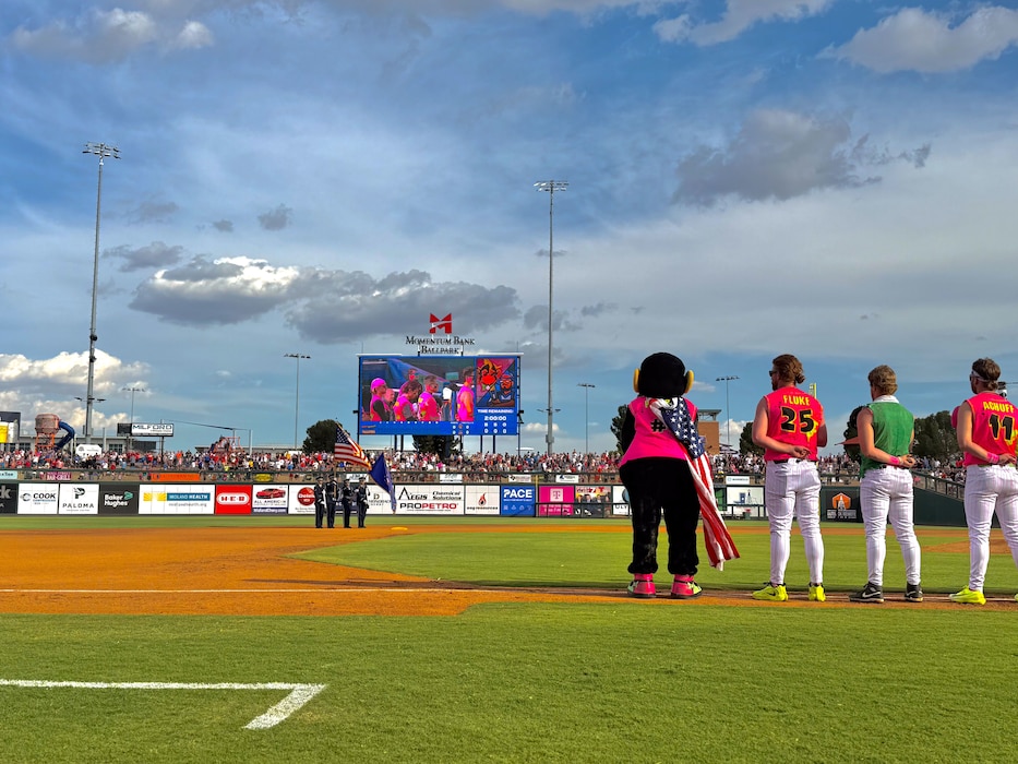 Base honor guard presents the colors center field before a baseball game