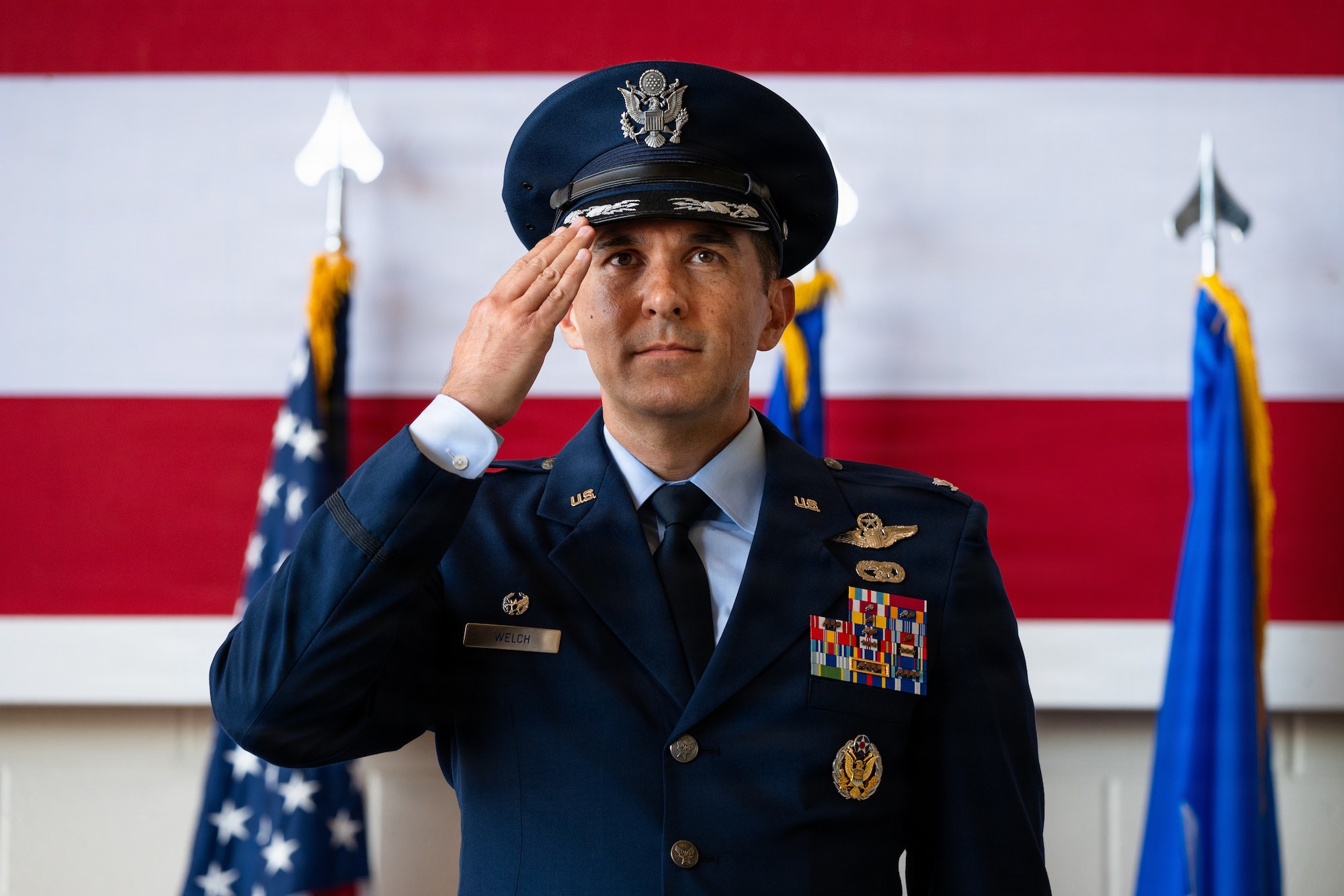U.S. Air Force Col. Christopher Welch, incoming 317th Airlift Wing commander, delivers his first salute to the wing during a change of command ceremony at Dyess Air Force Base, Texas, July 8, 2026. Welch is a senior pilot with over 3,300 flight hours in the KC-10A Extender and C-130J Super Hercules, including 1,300 combat hours across multiple operations. As the 317th AW commander, Welch will lead the world's largest fleet of C-130J, projecting rapid, tactical global mobility in contested environments. (U.S. Air Force photo by Senior Airman Jade M. Caldwell)