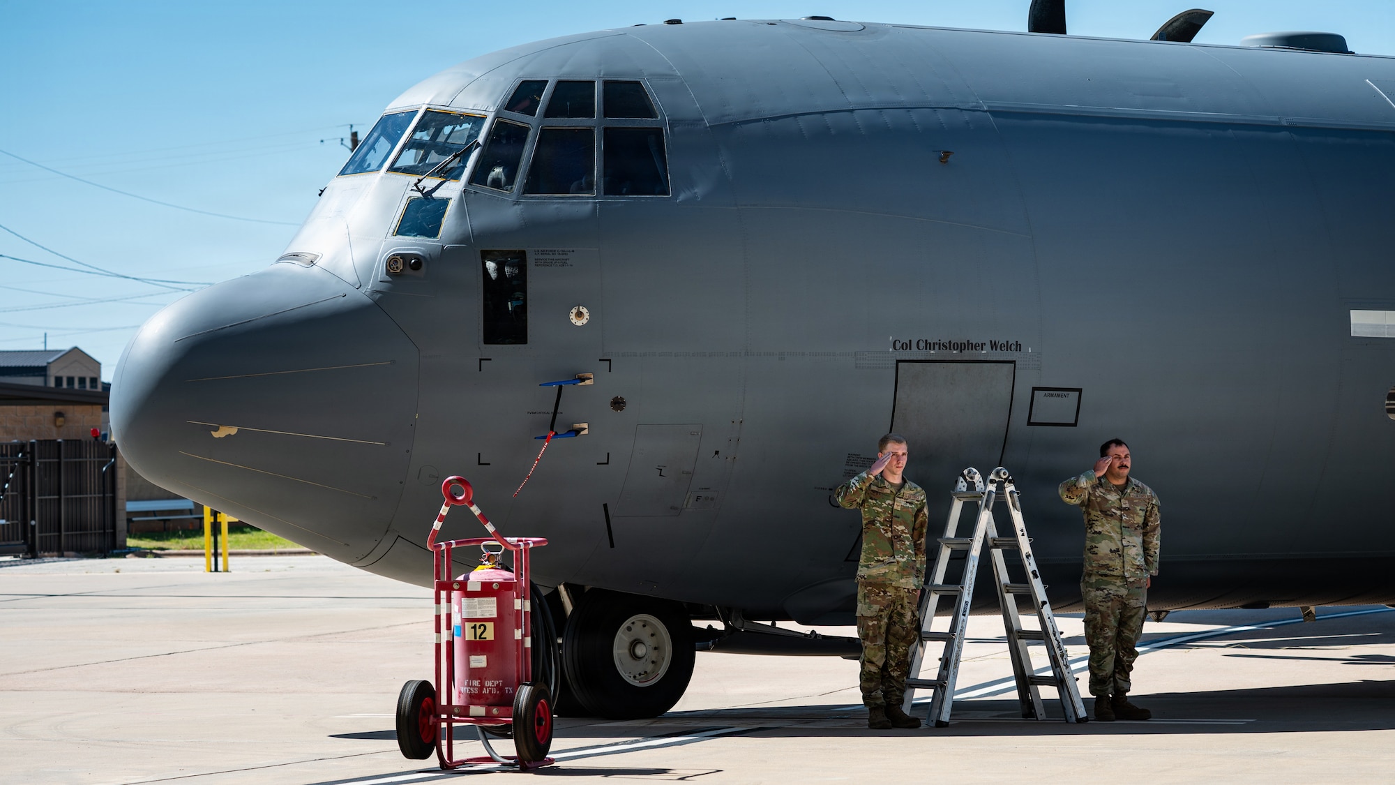 U.S. Airmen assigned to the 317th Airlift Wing change the name of the flagship C-130J Super Hercules during a change of command ceremony at Dyess Air Force Base, Texas, July 8, 2026. The ceremony welcomed Col. Christopher Welch as the new wing commander, placing him in charge of ensuring the readiness and resilience of the world’s largest fleet of C-130J. (U.S. Air Force photo by Senior Airman Jade M. Caldwell)