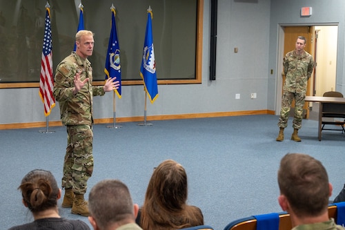 Image of person speaking to an audience.