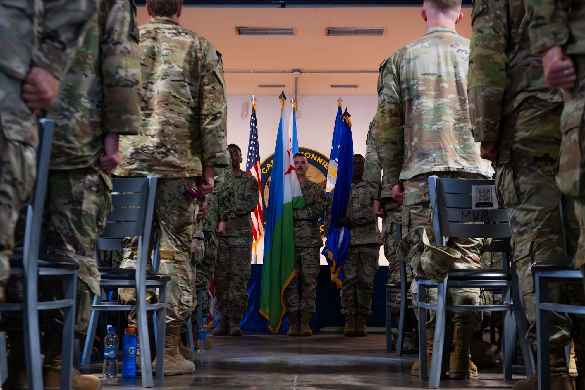 U.S. Air Force Honor Guard presents the Colors during the 449th Air Expeditionary Group Change of Responsibility ceremony at Camp Lemonnier, Djibouti, June 18, 2026. The 449th AEG serves as the Joint Air Component Coordination Element to Combined Joint Task Force-Horn of Africa and in partnership with joint, interagency, intergovernmental, and multinational teammates, the 449th AEG also engages in theater security cooperation activities. (U.S. Air Force photo by Senior Airman Luis Gomez)
