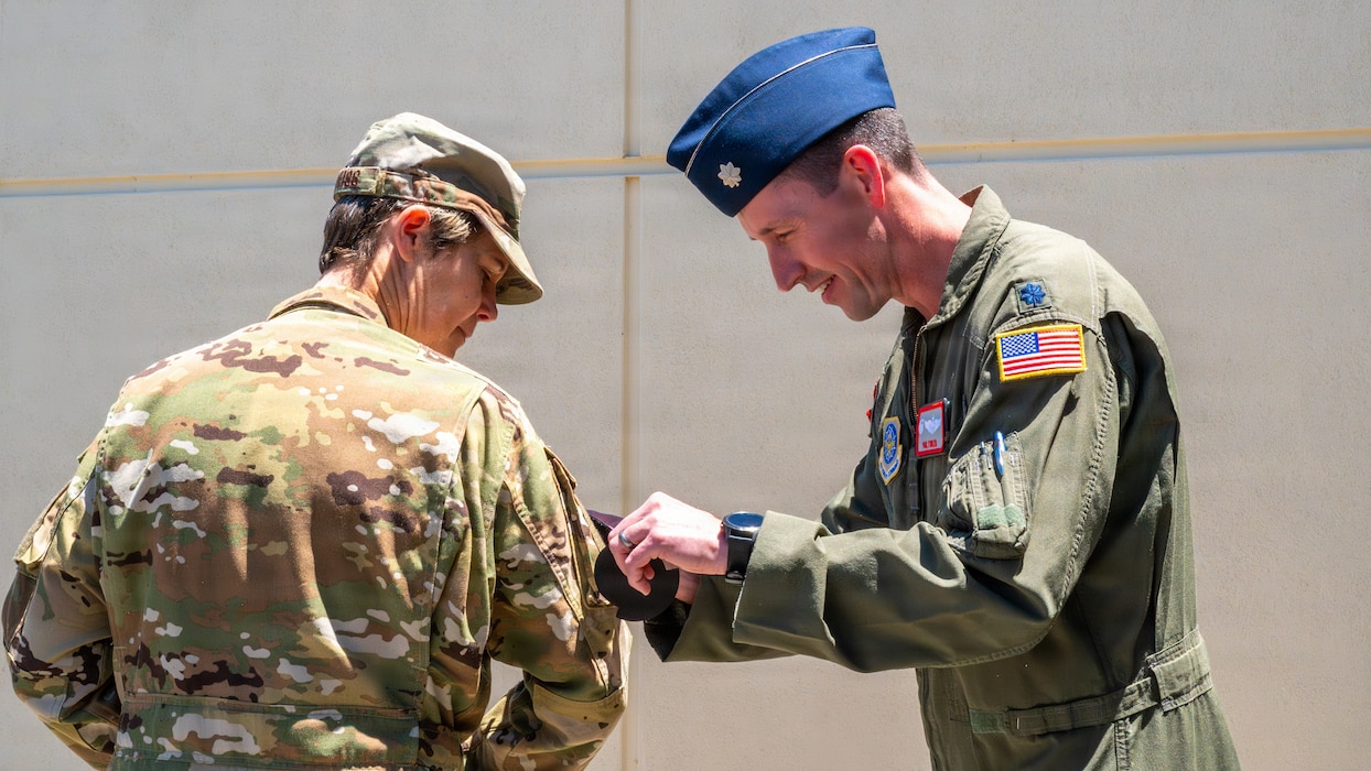 Commanders exchange patches.
