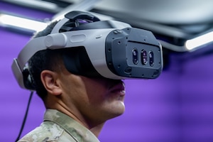 An air traffic controller assigned to the 1st Special Operations Wing tests a virtual reality headset