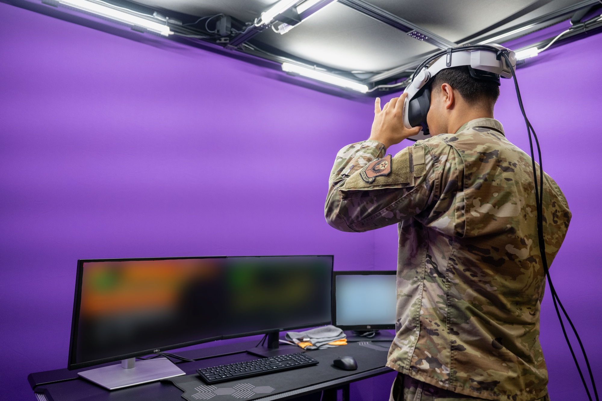 An air traffic controller assigned to the 1st Special Operations Wing uses a new virtual reality simulation system