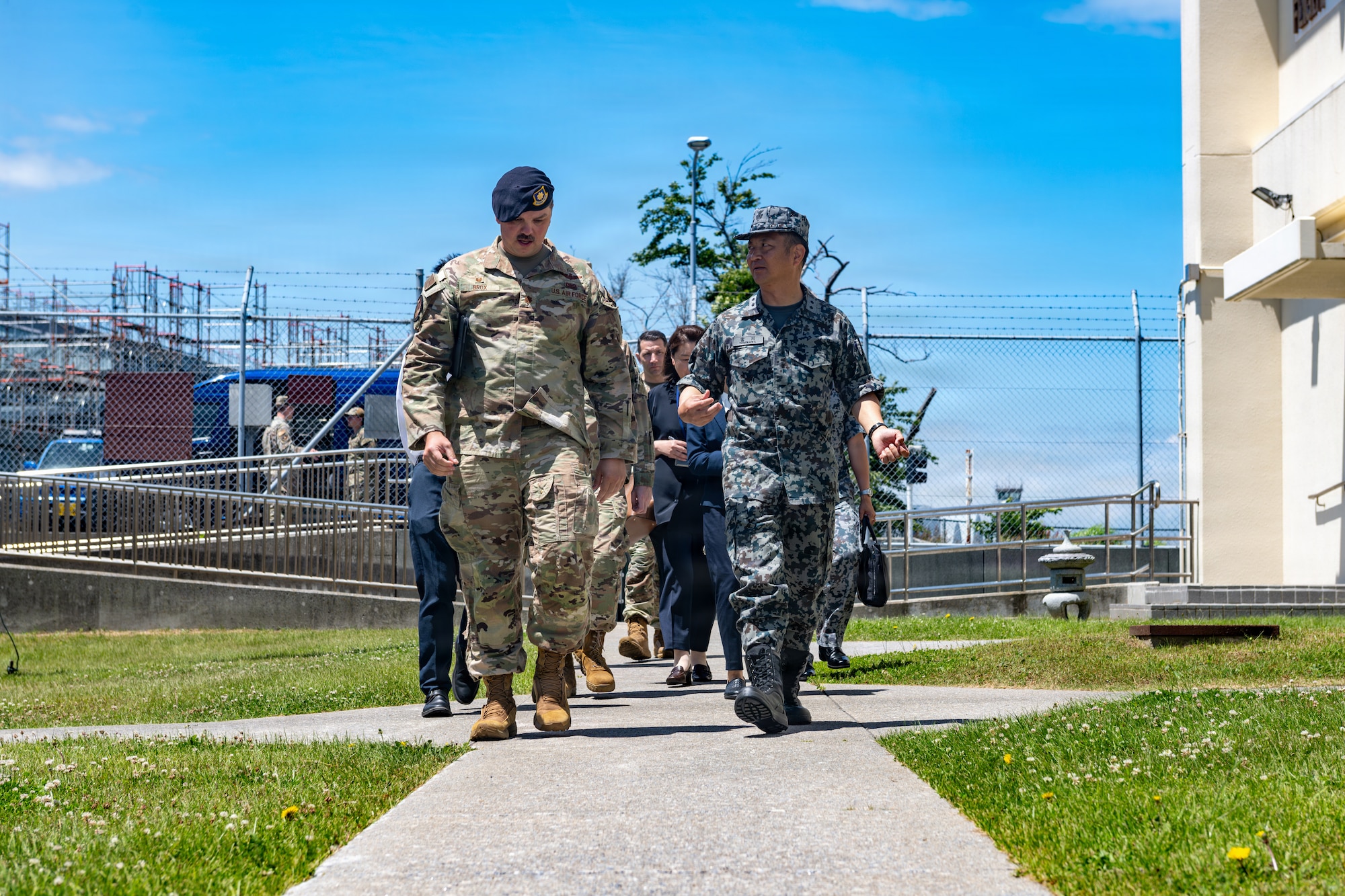 Japan Air Self-Defense Force Maj. Gen. Teru Tomikawa, right, 3rd Air Wing (AW) commander, and U.S. Air Force Maj. Mathew Brox, 35th Security Forces Squadron commander, discusses unit interoperability.
