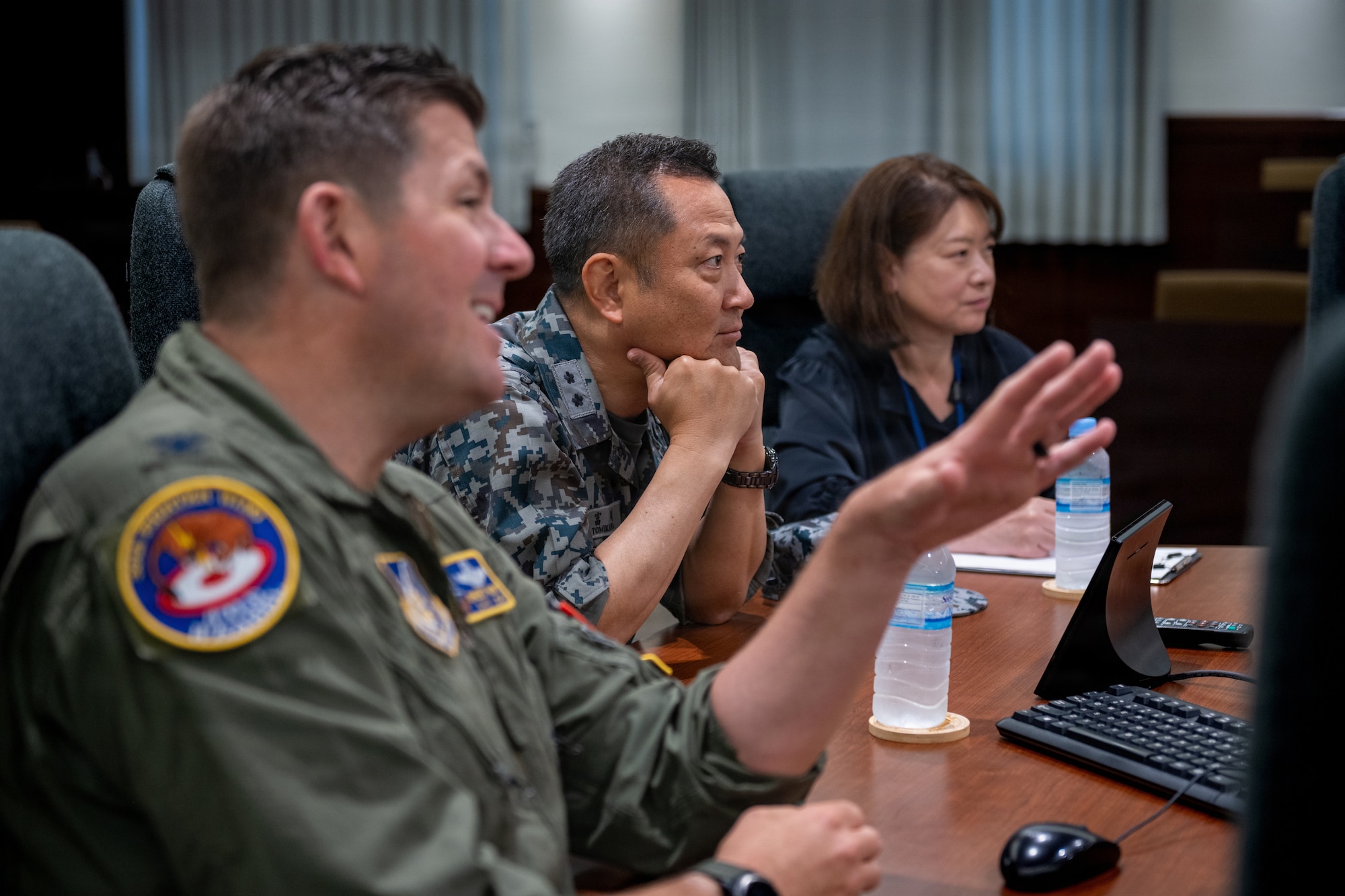 Japan Air Self-Defense Force Maj. Gen. Teru Tomikawa, center, 3rd Air Wing commander, listens to the 35th Fighter Wing (FW) mission brief.