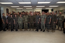 U.S. and Republic of Korea service members pose for a group photo during the opening ceremony for Combined Joint Logistics Over-the-Shore 26 at Camp Mujuk, Pohang, South Korea, July 6, 2026. CJLOTS 26 is a combined exercise designed to integrate U.S. and Republic of Korea lighterage and ship-to-shore connector capabilities, improve combined readiness, strengthen the Republic of Korea-U.S. alliance, and expand combined maritime sustainment capacity during logistics operations. (U.S. Marine Corps photo by Lance Cpl. Marcus Henson)