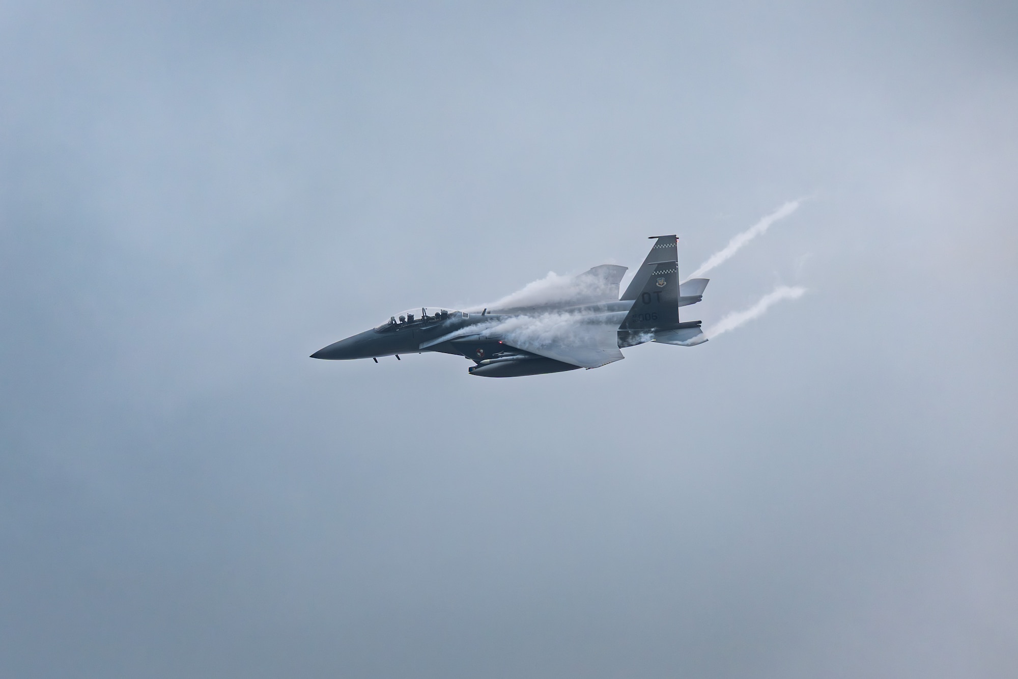 An F-15E Strike Eagle flies over Arnold Air Force Base during the Arnold Engineering Development Complex 75th anniversary open house celebration June 27, 2026, at Arnold AFB, headquarters of AEDC. The public open house was held to coincide with the original June 25, 1951, dedication of AEDC. Along with the F-15 flyover, the event included AEDC history tents, base bus tours and the AEDC Change of Command ceremony. (U.S. Air Force photo by Keith Thornburgh)