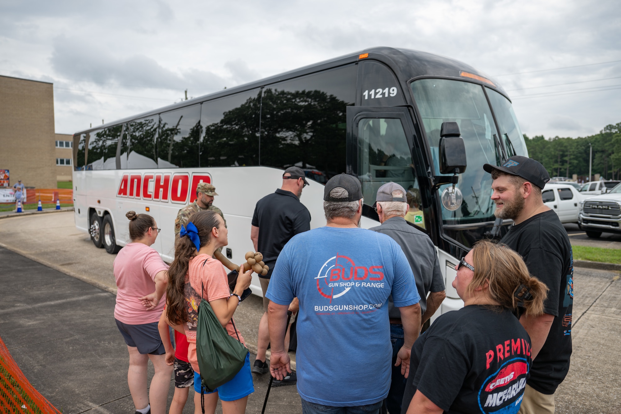 Attendees board a bus June 27, 2026, to participate in a base bus tour during the Arnold Engineering Development Complex 75th anniversary open house celebration June 27, 2026, at Arnold Air Force Base, Tenn., headquarters of AEDC. The public open house was held to coincide with the original June 25, 1951, dedication of AEDC. Along with bus tours, the event included AEDC history tents, an AEDC rededication ceremony and the AEDC Change of Command ceremony. (U.S. Air Force photo by Keith Thornburgh)