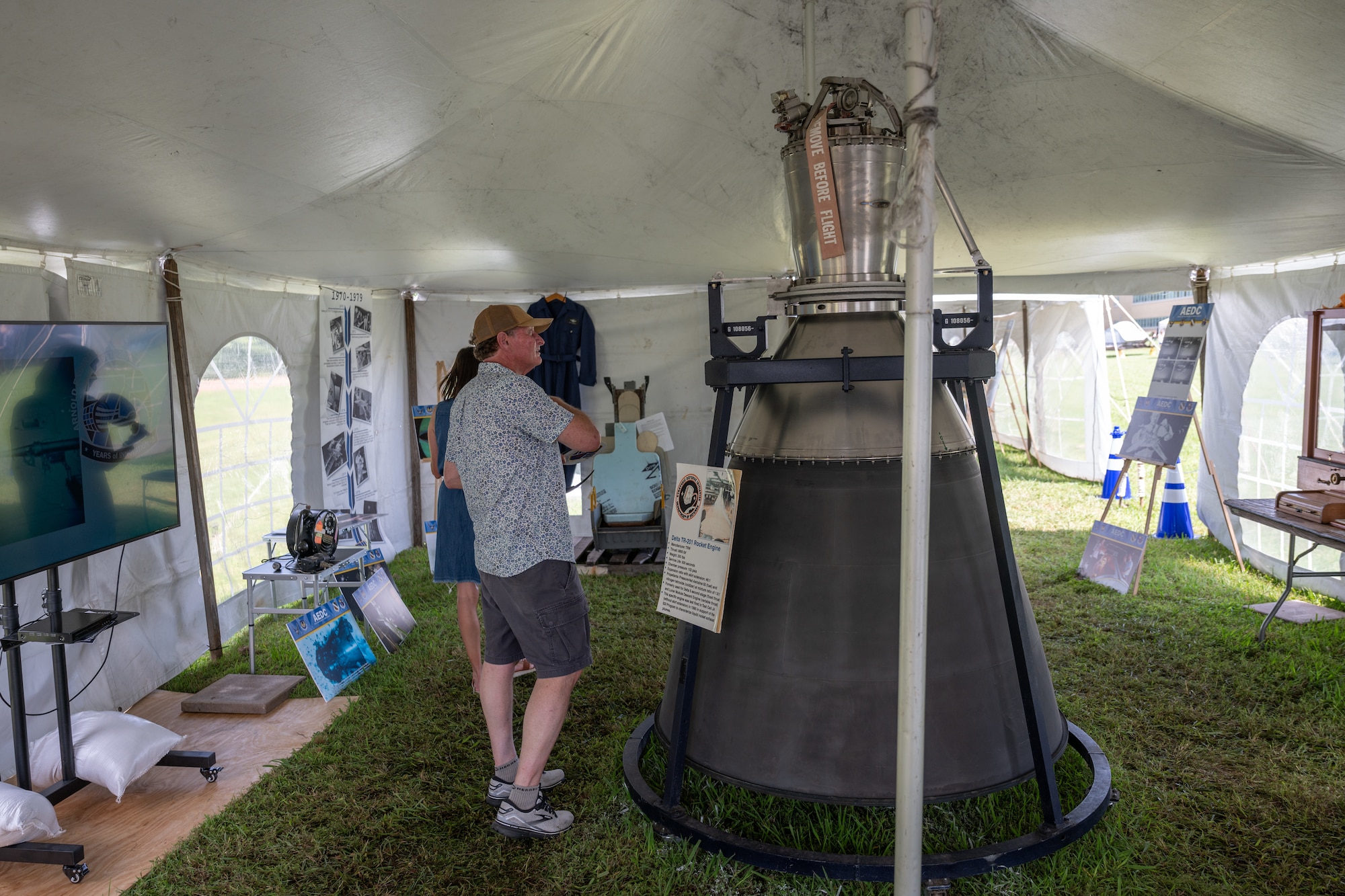 Attendees gets an up-close look at the Delta TR-201 rocket engine, which was previously tested in Arnold Engineering Development Complex facilities, during the AEDC 75th anniversary open house celebration June 27, 2026, at Arnold Air Force Base, Tenn., headquarters of AEDC. The public open house was held to coincide with the original June 25, 1951, dedication of AEDC. The event featured history tents that provided information on the accomplishments of AEDC throughout its first 75 years. (U.S. Air Force photo by Keith Thornburgh)