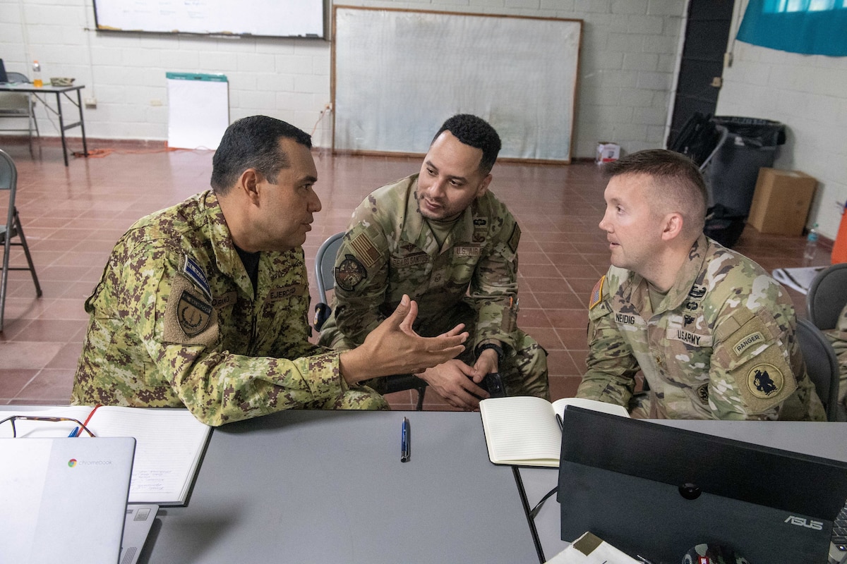 LEAP Scholar Master Sgt. Elio De Los Santos (center) interprets for El Salvador’s Army Colonel Ramon A. Soriano (left), Combined Joint Task Force Commander for the CENTAM Guardian 26 exercise, and U.S. Army Maj. Jon Neidig, who acted as the U.S. Commander for the CJTF and was an advisor for Col Soriano throughout the exercise