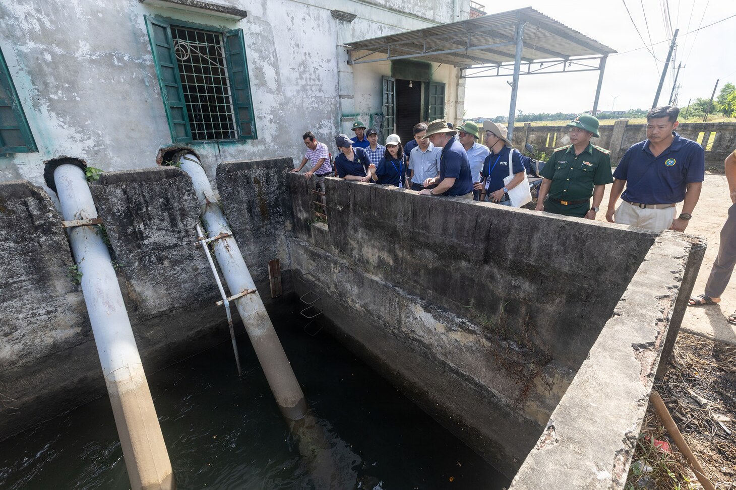 Servicemembers assigned to Pacific Partnership 2026 (PP26) and members of the Quang Tri Sub-department of Irrigation and Disaster Prevention visit Left-bank Le Ky River Dike System during a disaster management field training exercise in Quang Tri, Vietnam, July 2, 2026.
